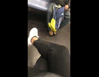 Guy on subway sneaks beer out backpack 