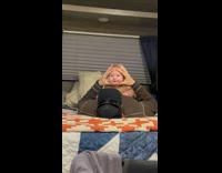 Dad plays son on bed squeeze face