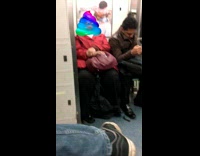 Sleeping Woman Turned to Rainbow Poop Emoji Head
