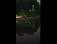 Guy takes change from fountain 