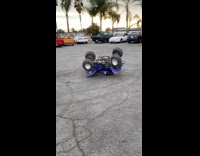 Guy falls off blue atv doing donuts 