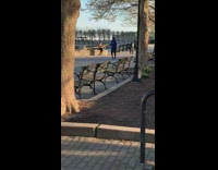 Woman black workout attire sit seaside photo shoot sunset