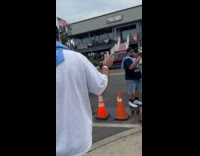 Man follow and films Irish marching band