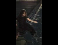 Girl pushes sitting friend into pool water 