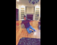 Woman slides and falls with broom 