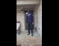 Girl coming with suitcase cheer with guy in front of house