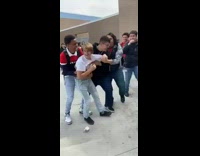 Guys do a cheer stunt on concrete 