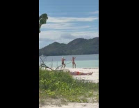 Woman bikini photoshoot while the filmer reacts