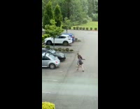 Two women gray shade jacket tiktok dance parking lot