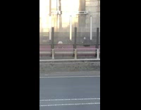 Girl denim shorts dance twerk beside highway