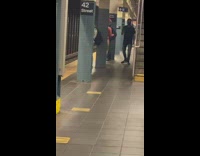 Lady wears red bikini and feather in hair 