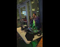 Man purple ruffles coat lip sync DJ