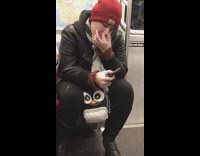 Guy red beanie picks nose and eats boogers on subway train