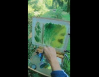 Man paints and sits on top of a tree in the forest Part 4