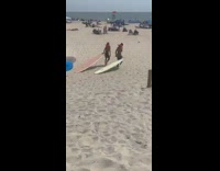 Collab Kook Of The Day - Two guys drag surfboards red life vest 