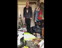 Grey jacket black pants guy dances sings