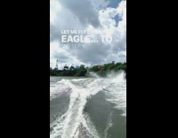 Red life jacket guy falls off wakeboard 