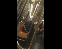 Man drags his suitcase onto subway and unpacks it