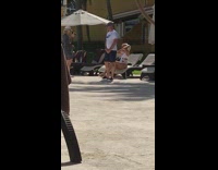 Girl white swimsuit sit chair hold sunglasses