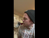 Man Sticks Out Tongue to Talk with Dog