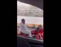 Guy sings to Baby on motorcycle 