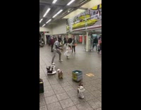 Guy dances in Jesus costume to musician 
