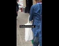 Collab WINY - Woman on sidewalk with macaw bird on shoulder