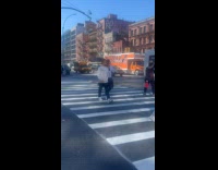 Woman black panty hold umbrella cross street