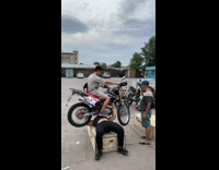 Collab BitchIG2 - Man lifting motorbike with guy riding it 