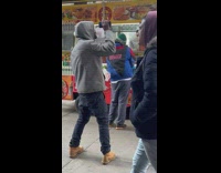 Man Dance to Music as he Waits in Line