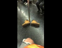 Pair of timberland boots subway train floor 