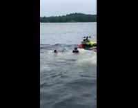 Lady falls into water after trying to pour beer in friends mouth 