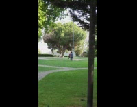 Guy red shirt gloves punch grey pole