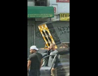 Large speaker on grey car roof music 