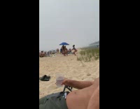 Three girls squat jump workout beach umbrella