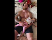 Father and Daughter Sleeps Comfortably on the Couch