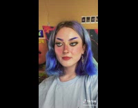 Girl puts makeup eyes on eyelids 
