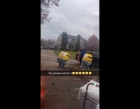 Group of kids dressed as minion walk by driveway halloween 