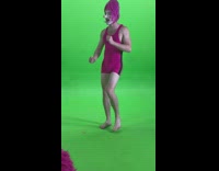 Guy in tight magenta dress with wig and fake nose doing photoshoot
