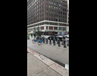 Guy doing pushups next to fedex delivery truck