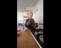 Woman burns potatoes and plastic trash bin