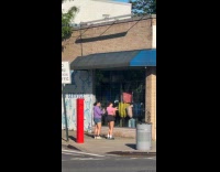 Collab WINY - Two women dance on street outside store