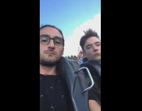 Two men rides in rollercoaster no reaction
