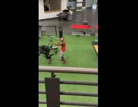 Man lifts and flips exercise gym equipment