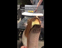Woman show brown slippers melted by fire pit