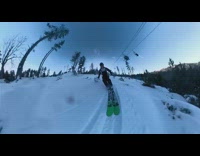 Guy trips on green skis fisheye lens