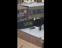 Guy black shirt push up rooftop banner