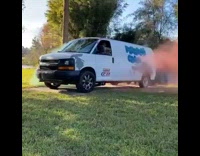 Red green smoke comes out of van 
