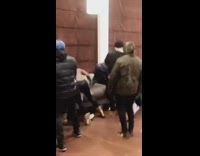 Group of people fighting each other