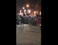 Man in suit dances and selfies with pet dog